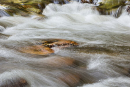Waterfalls and rocks in forestの写真素材