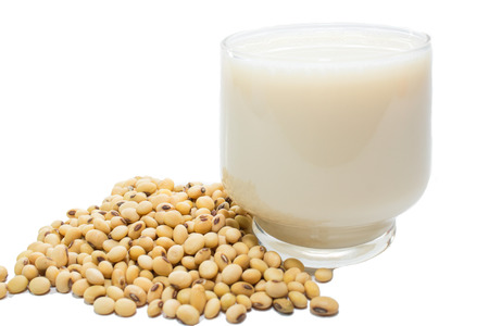 Soybeans and soy milk in a glassの写真素材