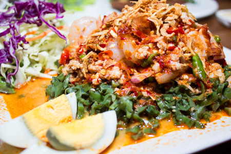 Seafood Salad Salad with prawns, mussels, squids, onions decorated by lemon and parsleyの写真素材