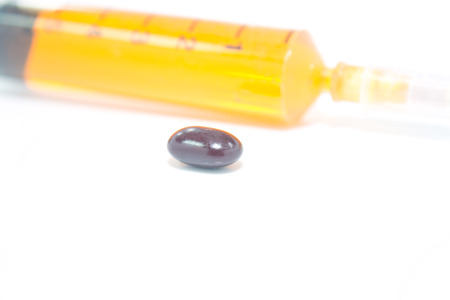Medicine capsule with syringeの写真素材