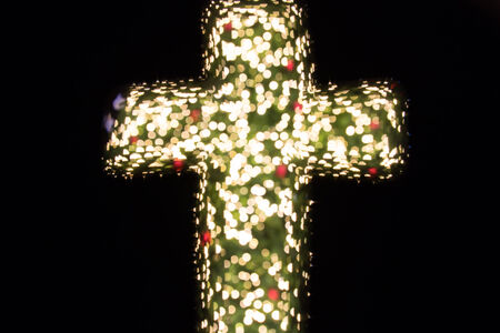 christian cross with bokeh light backgroundの写真素材