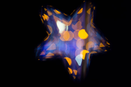 Defocused star bokeh on christmas lightの写真素材