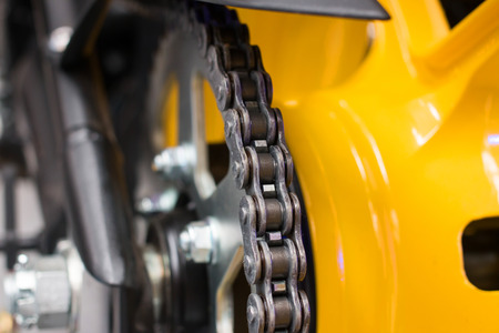 Enduro motorbike wheel and chain. Closeup shotの写真素材