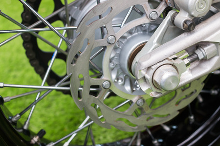 Enduro motorbike wheel and chain. Closeup shot