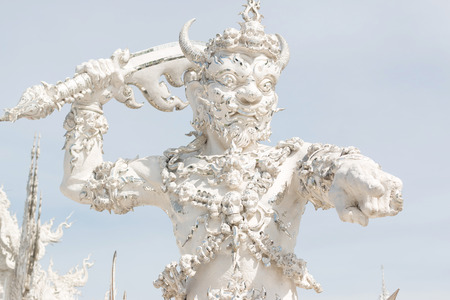 Angel of death statue in Wat Rong Khun, the famous white temple of Thailandの写真素材