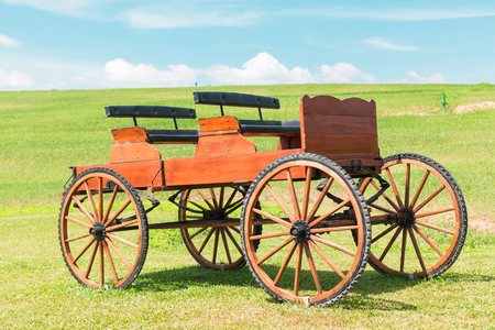 historic carriage on beautiful field and Blue skiesの写真素材