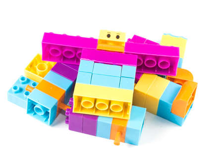 Toy colorful plastic blocks isolated on white background