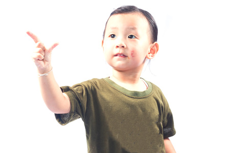 little girl with gun isolated on white backgroundの写真素材