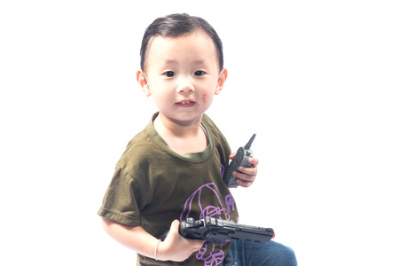 little girl with gun isolated on white backgroundの写真素材