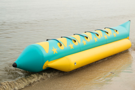 banana boat lays on a beachの写真素材