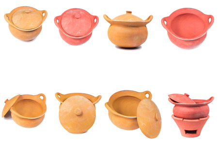 Traditional stoves and pots set made of red clay isolate on whiteの写真素材