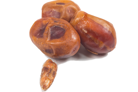 fresh organic date palm on white backgroundの写真素材