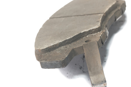 Old brake pads disk brake, isolated on a white backgroundの写真素材