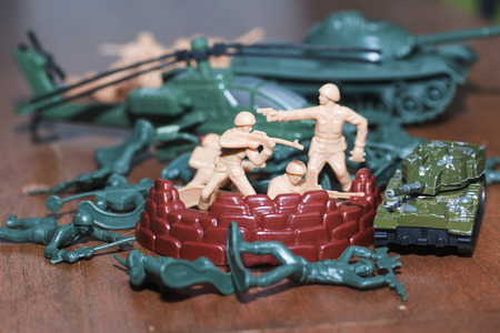 Plastic toy soldiers are doing war