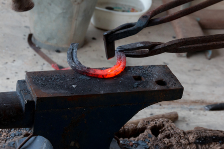 Farrier making horseshoe by Ancient styleの写真素材