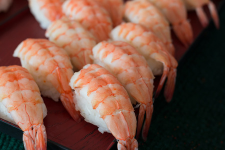 Sushi rolls on a plate with shrimps meatの写真素材