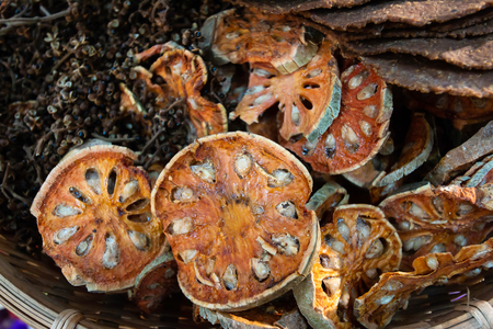 Bael dry Other herbs in Bamboo basketの写真素材