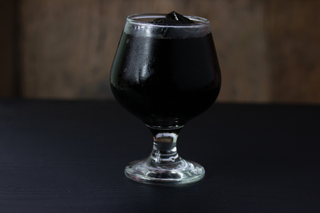 Grass jelly In a glass isolated on table backgroundの写真素材