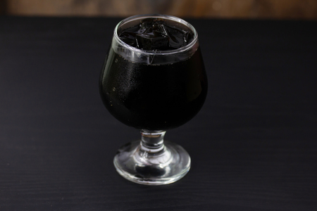 Grass jelly In a glass isolated on table backgroundの写真素材