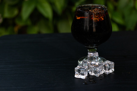 Soft drink mix Ice in glass isolate on tableの写真素材