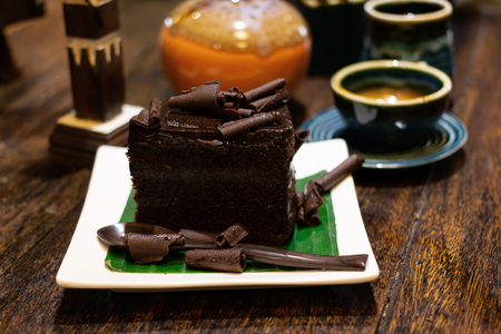 Chocolate Cake and Tea and coffee In a ceramic cup on table woodの写真素材