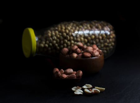 Peanut on Cup made of wood and spoon