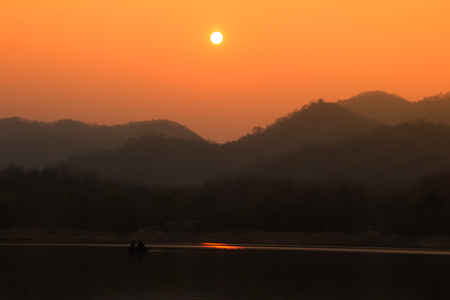 Villagers are catching fish by fish trap (net trap) in reservoirの写真素材