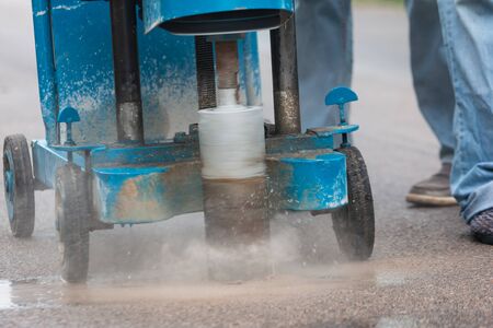 Engineering is drilling the road by Road drilling machine for Check road standards