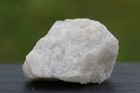 fluorite stone mineral crystal sample for science and geology isolate on green background