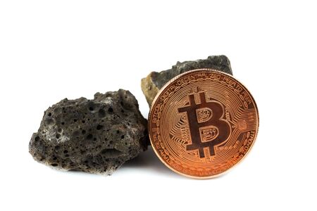 Basalt rock and bit coin isolate on white backgroundの写真素材