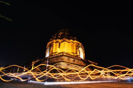 Candle lit tradition in temple of Thailand