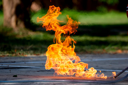 Firefighters are practicing firefighting plans are putting out a burning fireの写真素材