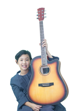 Asian young woman holding a guitar isolated on white background with clipping pathの写真素材