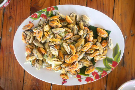 Boiled shellfish  and Cockle eaten with seafood dipping sauce is a famous food in Thailandの写真素材