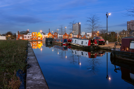 Boat houses moored in a canal in New islington A newly developed area in Manchester のeditorial素材