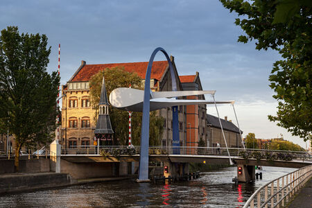 This bascule style bridge is build over a canal in leeuwarden and a gateway to the town center of Leeuwarden Netherlands.のeditorial素材