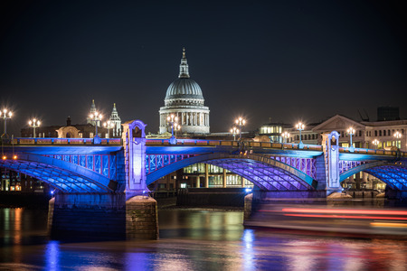 St Paul's Cathedral famous landmark of london poking behind Southwark bridge, London , England.の写真素材