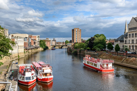 Boats on river Ouse in York, Englandの写真素材