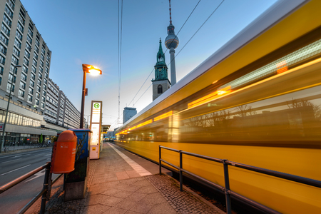 Metro tram bus at Alexanderplatz in central Mitte district of european capital city with televison tower known as " Fernsehturm " on backgroundのeditorial素材