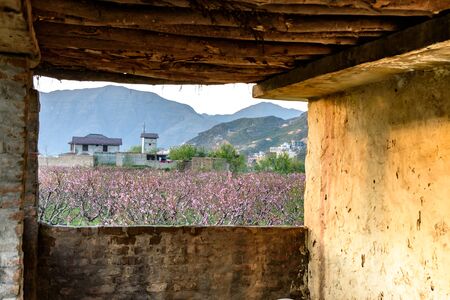 View of Swat valley in Pakistan through a window of old mud house.の写真素材