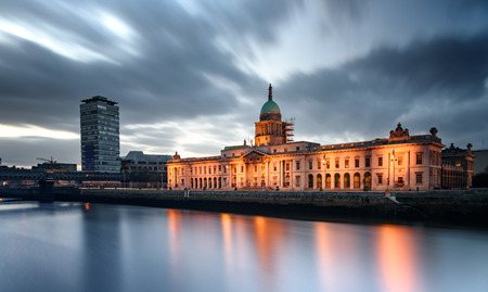 View of Custom House on the bank of river Liffey under dark cloudy skyline, Dublin, Irelandのeditorial素材