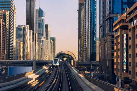 Dubai's downtown architecture with metro monorail train