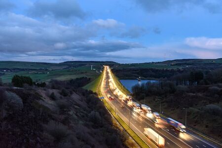 Busy traffic on M62 motorway near Leeds, West Yorkshire, England.