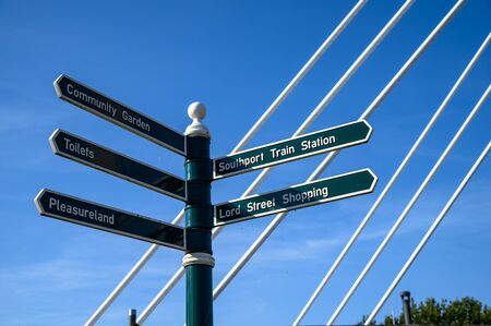 Wooden guide poles and tourists information  poles in Southport, England.の写真素材