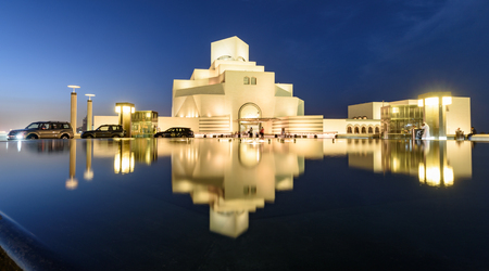 Circa April 11, 2019 - DOHA ABU DHABI: Exterior view of Museum of Islamic Arts and its reflection in...