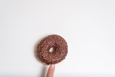 chocolate doughnut isolated over white, view topの写真素材