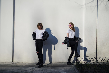 Dissociative disorder, girl in black against the background of the white wallの写真素材