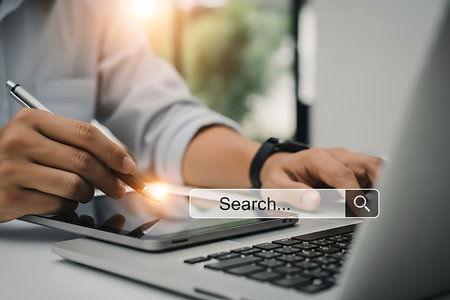 Businessman hands typing on keyboard holding smartphone with email notification image 3の素材