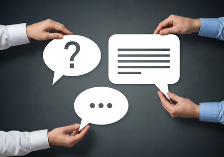 Hands holding speech bubbles with question mark and text communication conversationの素材