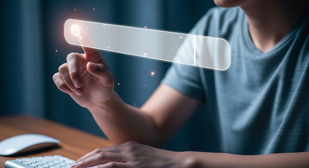 A person's hand touches a glowing transparent search bar interface with small digital particles floating around.の素材